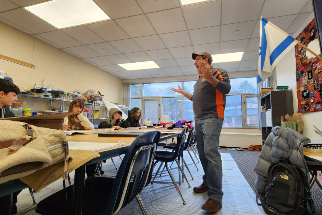 man teaching a comics class.